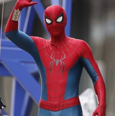 Tristen in the Spider-Man suit, waving
